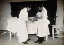 F Lejars demonstrating operation techniques, c1900s. Creator: E Guillot
