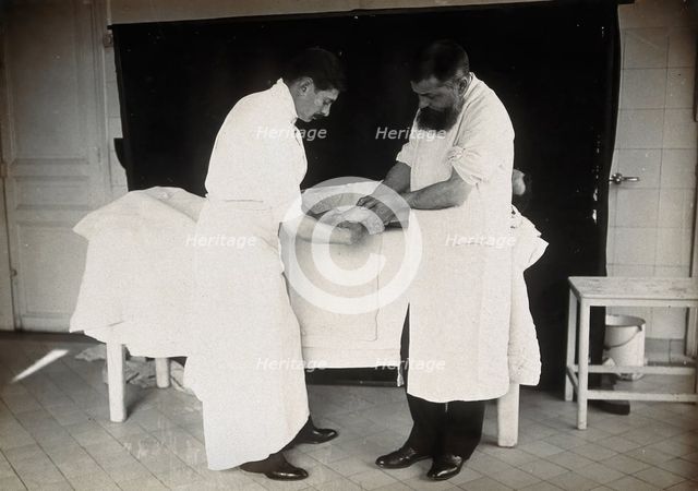 F  Lejars demonstrating operation techniques, c1900s. Creator: E Guillot.