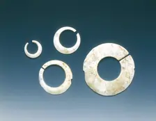 Four altered jade asymmetrical slit-discs, Neolithic, Liangzhu culture, China, c3400-2200 BC. Creator: Unknown