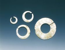 Four altered jade asymmetrical slit-discs, Neolithic, Liangzhu culture, China, c3400-2200 BC. Creator: Unknown