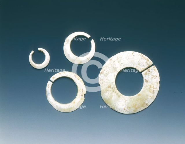 Four altered jade asymmetrical slit-discs, Neolithic, Liangzhu culture, China, c3400-2200 BC. Creator: Unknown.