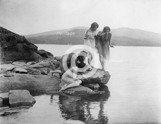 Four figures at water edge, c1914. Creator: Frances Benjamin Johnston.