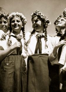 Four German girls smiling with garlands in their hair, c1936. Creator: Unknown