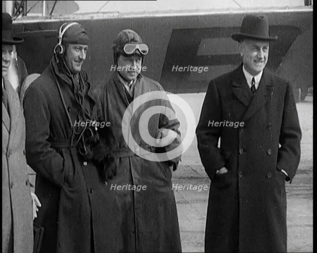 Four Male Civilians Standing in Front of a Plane, 1929. Creator: British Pathe Ltd.