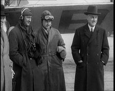 Four Male Civilians Standing in Front of a Plane, 1929. Creator: British Pathe Ltd