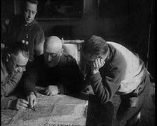 Four Men Consulting a Map in an Office, 1937. Creator: British Pathe Ltd