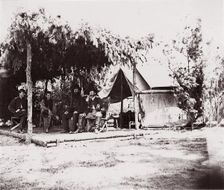 [Four men in camp under a lean-to of pine boughs], 1861-65. Creator: Unknown