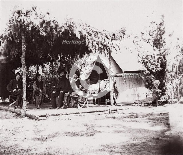 [Four men in camp under a lean-to of pine boughs], 1861-65. Creator: Unknown.