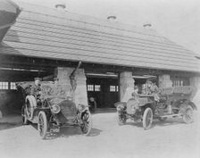 Four men with two automobiles outside of garage of Edmund Cogswell..., Greenwich, Connecticut, 1908. Creator: Frances Benjamin Johnston