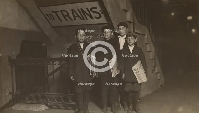 Four Newsies at an Entrance to the Subway, New York City, 1910. Creator: Lewis Wickes Hine.