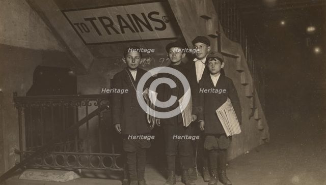 Four Newsies at an Entrance to the Subway, New York City, 1910. Creator: Lewis Wickes Hine.