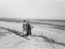 Four of the seven Browning children wait for the school bus..., Dead Ox Flat, Oregon, 1939. Creator: Dorothea Lange