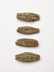 Four peg-like objects, perhaps imitations of canine teeth, 1200-1400. Creator: Unknown