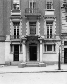 Four-story townhouse, entrance with pilasters and curved pediment, possibly New York, c1900-1905. Creator: William H. Jackson