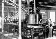 Fourteen thousand tins an hour! A machine that fills tins of "shoeshine", 1909. Creator: Unknown