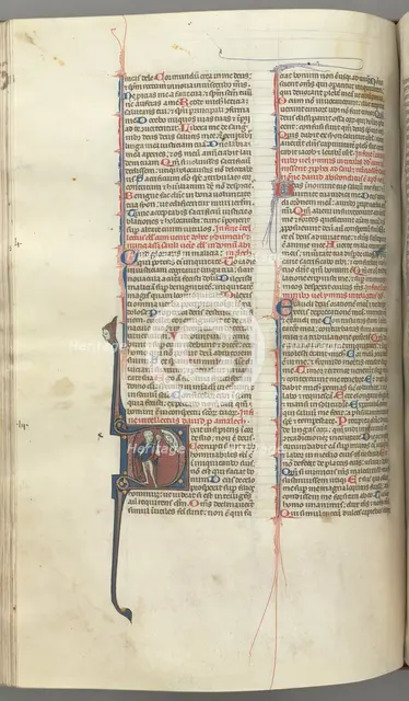 Fol. 222v, Psalm 52, historiated initial D, a fool naked but for a cloak, holding a bladder..., c. 1 Creator: Unknown.