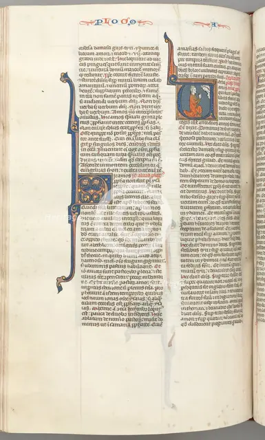 Fol. 354v, Amos, historiated initial V, Amos kneeling in prayer, bust of God above, c. 1275-1300. Creator: Unknown.