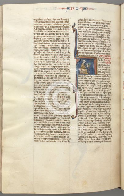 Fol. 482v, Revelations, historiated initial A, John seated at a desk writing..., c. 1275-1300. Creator: Unknown.