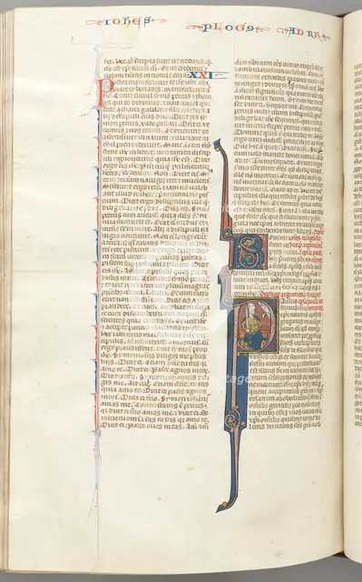 Fol. 435v, Romans, historiated initial P, Paul seated with a sword talking to the bust of God..., c. Creator: Unknown.