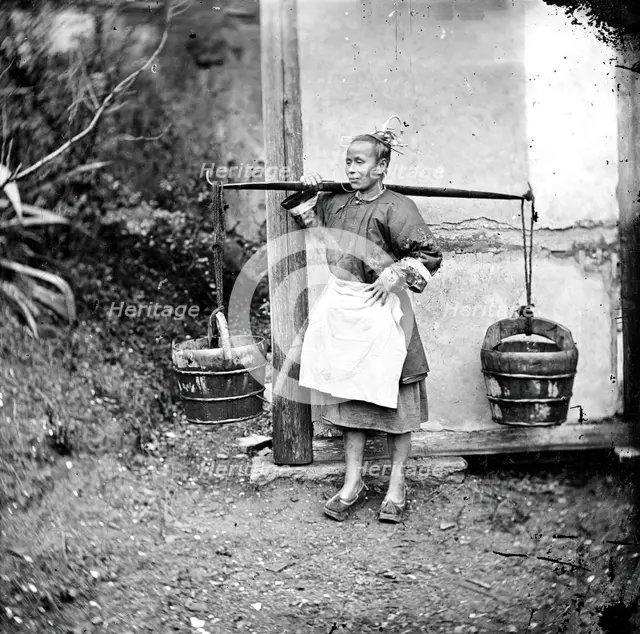 Foochow, Fukien province, China: a woman carrying buckets of night-soil, 1871. Creator: John Thomson.