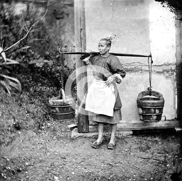 Foochow, Fukien province, China: a woman carrying buckets of night-soil, 1871. Creator: John Thomson.
