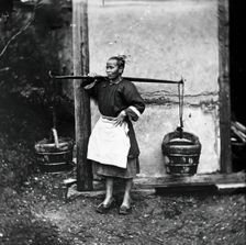 Foochow, Fukien province, China: a woman carrying buckets of night-soil, 1869 (1981). Creator: John Thomson