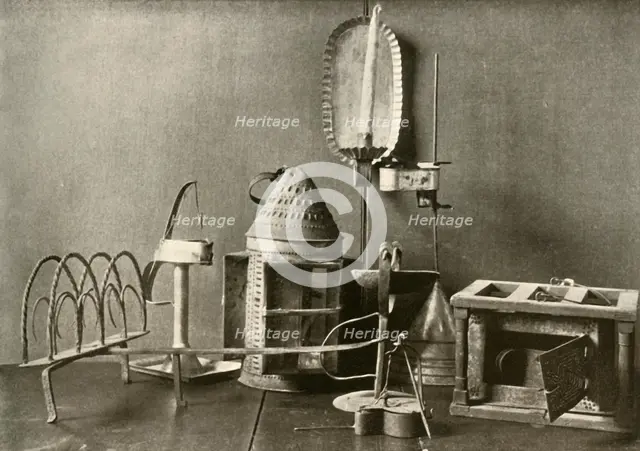 'Foot-warmer; oil lamps; candle sconce; tin lantern; and toaster', c18th century, (1937).  Creator: Unknown.
