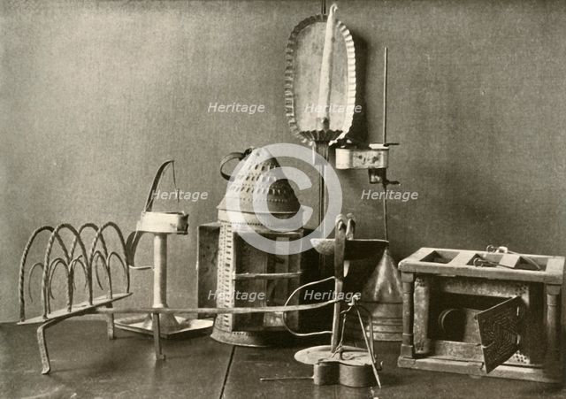 'Foot-warmer; oil lamps; candle sconce; tin lantern; and toaster', c18th century, (1937).  Creator: Unknown.