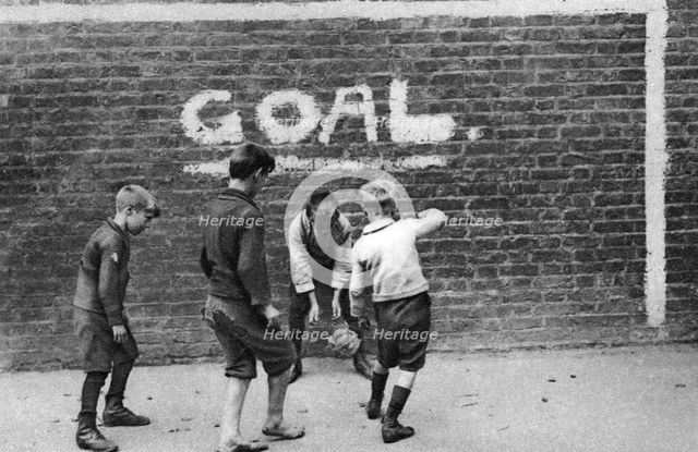 Football in the East End, London, 1926-1927. Artist: Unknown