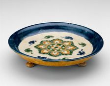 Footed Dish with Lotus Medallion and Cloud Scrolls, Tang dynasty...first half of 8th century. Creator: Unknown