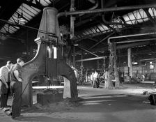 Forge in action at Edgar Allen's steel foundry, Sheffield, South Yorkshire, 1963. Creator: Michael Walters