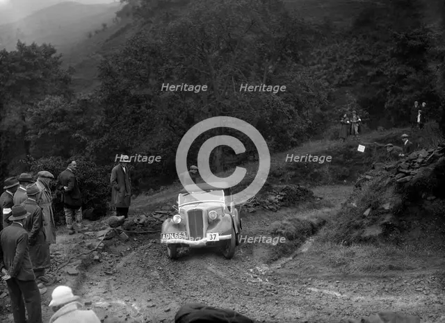 Ford 10 tourer of J Harrison competing in the MCC Sporting Trial, 1935. Artist: Bill Brunell.