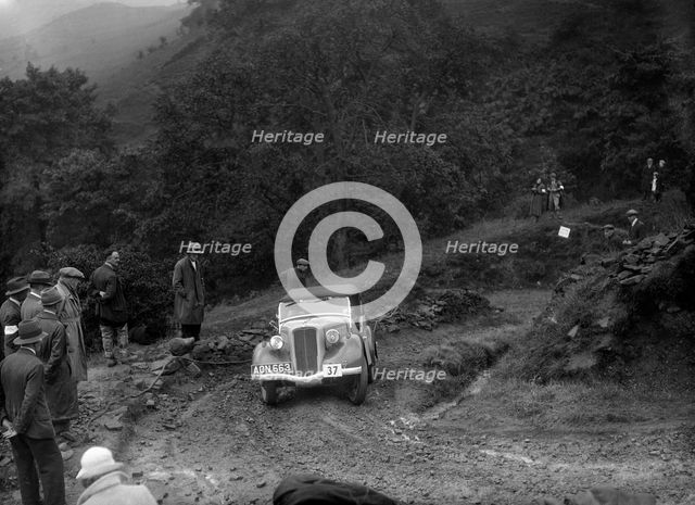 Ford 10 tourer of J Harrison competing in the MCC Sporting Trial, 1935. Artist: Bill Brunell.