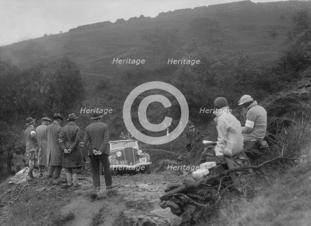 Ford 10 tourer of J McEvoy competing in the MCC Sporting Trial, 1935. Artist: Bill Brunell.