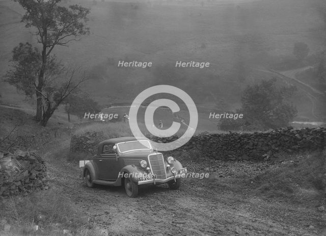 Ford V8 2-seater and dickey of IDK Stewart competing in the MCC Sporting Trial, 1935. Artist: Bill Brunell.
