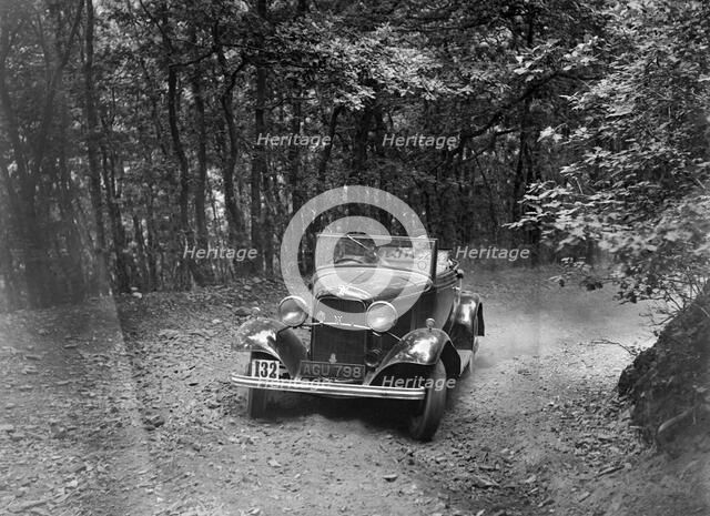 Ford V8 competing in the B&HMC Brighton-Beer Trial, Fingle Bridge Hill, Devon, 1934. Artist: Bill Brunell.