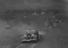 Ford V8 competing in the London Motor Club Coventry Cup Trial, Knatts Hill, Kent, 1938. Artist: Bill Brunell
