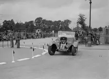 Ford V8 of TC Wise competing in the South Wales Auto Club Welsh Rally, 1937 Artist: Bill Brunell