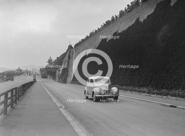 Ford V8 of CGH Barraclough on Madeira Drive, Brighton, RAC Rally, 1939. Artist: Bill Brunell.