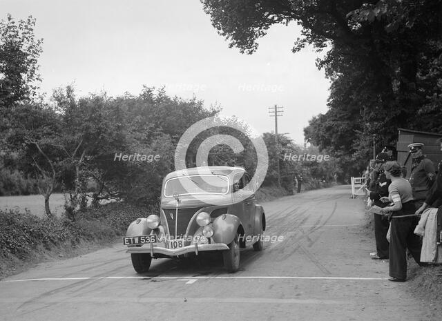 Ford V8 of J McEvoy, winner of a bronze award at the MCC Torquay Rally, July 1937. Artist: Bill Brunell.