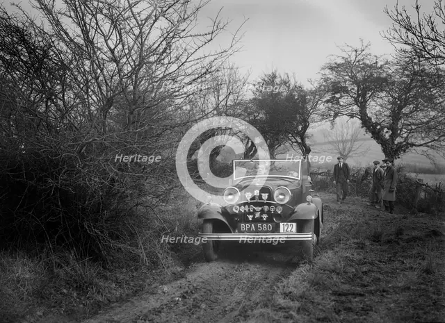 Ford V8 of K Hutchison at the Sunbac Colmore Trial, near Winchcombe, Gloucestershire, 1934. Artist: Bill Brunell.