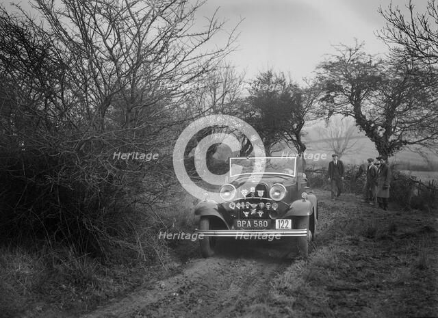 Ford V8 of K Hutchison at the Sunbac Colmore Trial, near Winchcombe, Gloucestershire, 1934. Artist: Bill Brunell.