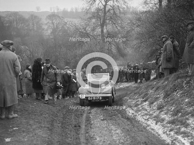 Ford V8 open tourer of H Hillcoat competing at the Sunbac Colmore Trial, Gloucestershire, 1933. Artist: Bill Brunell.