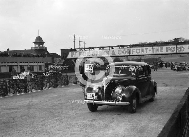 Ford V8 saloon competing in the JCC Rally, Brooklands, Surrey, 1939. Artist: Bill Brunell.