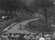 Ford V8 saloon competing in the Shelsley Walsh Hillclimb, Worcestershire, 1935. Artist: Bill Brunell
