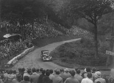 Ford V8 saloon competing in the Shelsley Walsh Hillclimb, Worcestershire, 1935. Artist: Bill Brunell