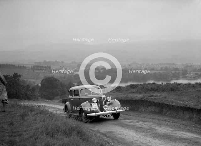 Ford V8 saloon competing in the South Wales Auto Club Welsh Rally, 1937 Artist: Bill Brunell.