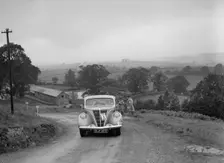 Ford V8 saloon competing in the South Wales Auto Club Welsh Rally, 1937 Artist: Bill Brunell