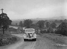 Ford V8 saloon competing in the South Wales Auto Club Welsh Rally, 1937 Artist: Bill Brunell