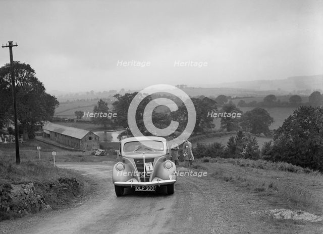 Ford V8 saloon competing in the South Wales Auto Club Welsh Rally, 1937 Artist: Bill Brunell.